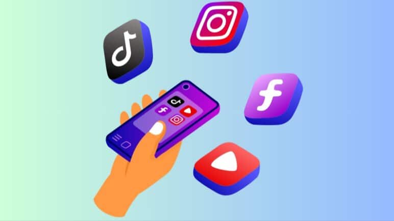 A hand holding a phone with Social Media icons of TikTok, YouTube, Facebook and Instagram on it
